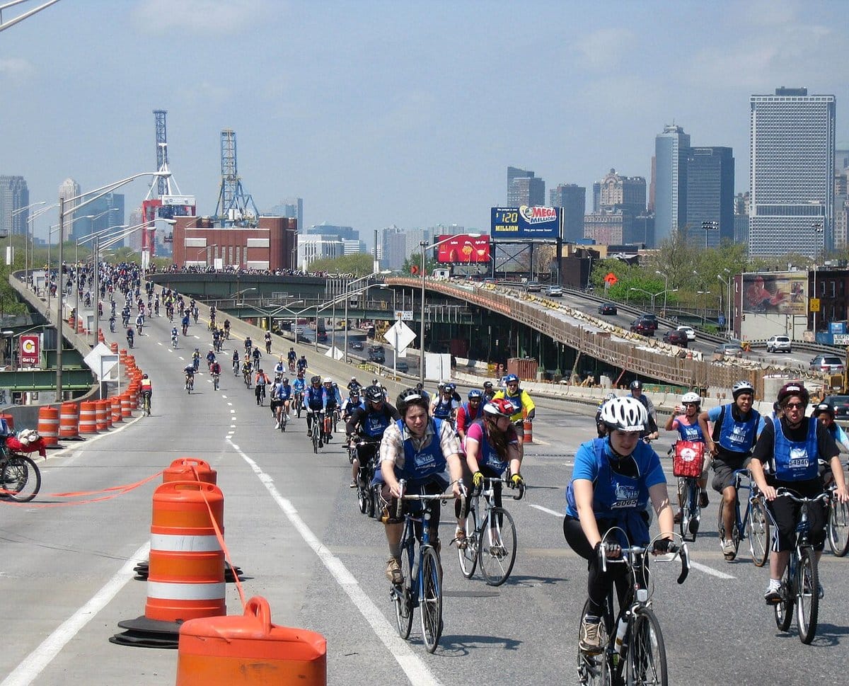 Mass city bike ride along an open highway