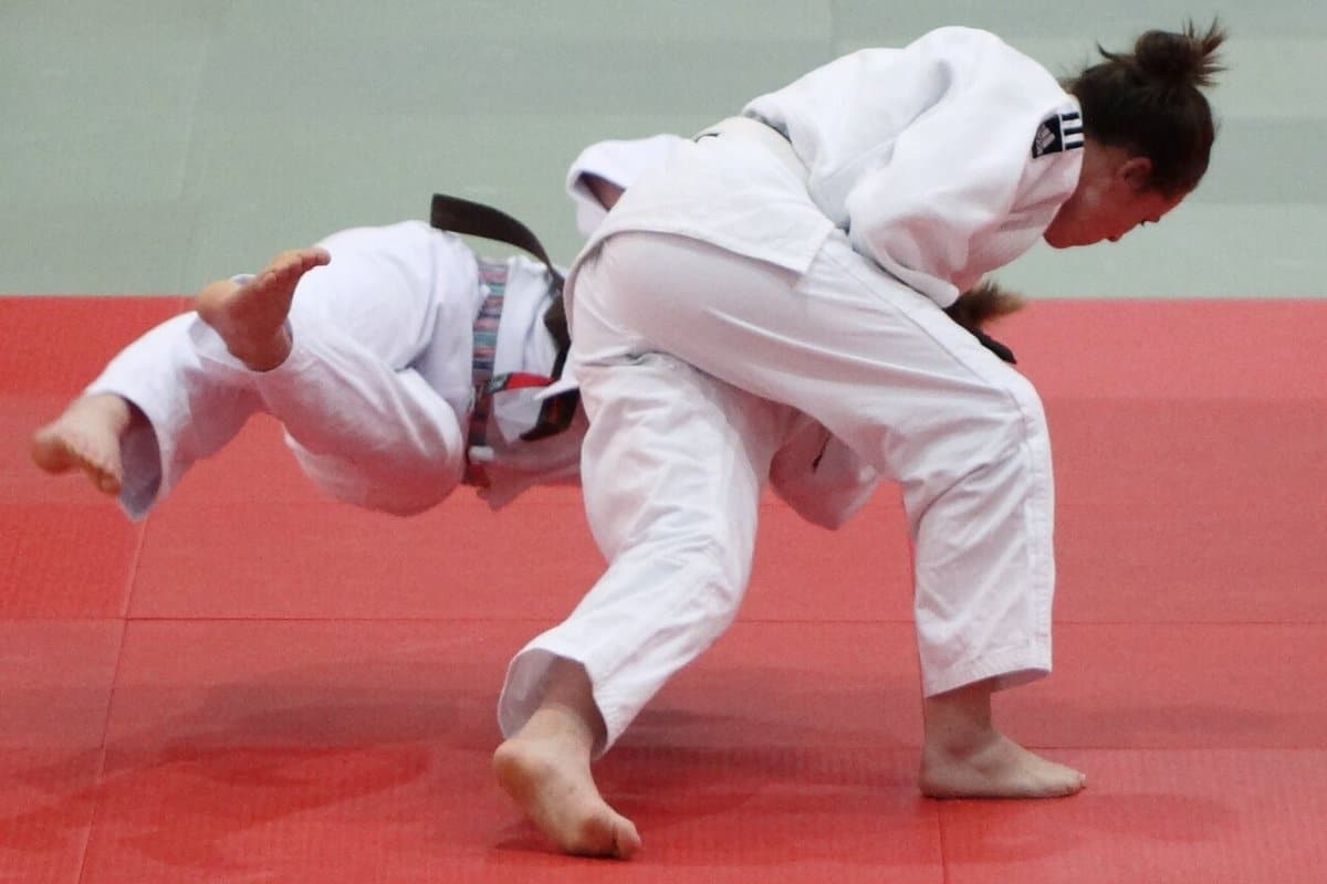 Judoka executing a throw during a match