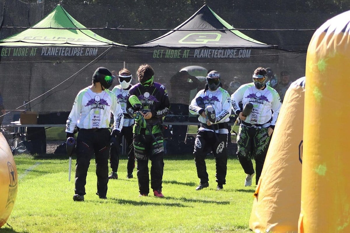 Paintball team walking onto a speedball field
